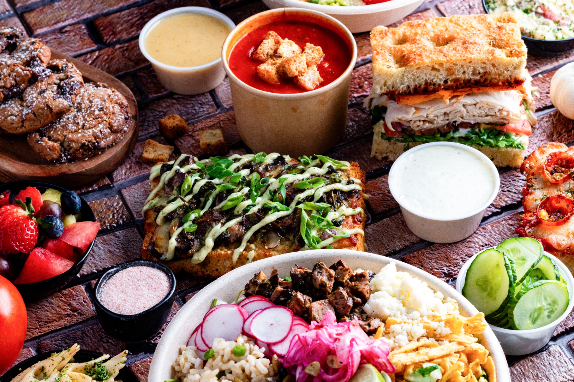 A spread of scratch-made dishes, soups, sandwiches, and sides