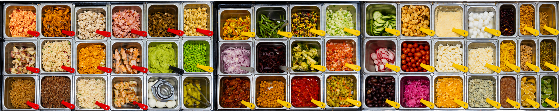 A full spread of scratch-made bowl ingredients in chilled prep trays